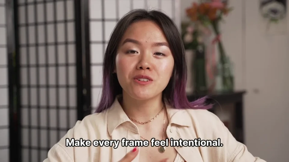 A woman speaking to camera with a single line of outlined captions
