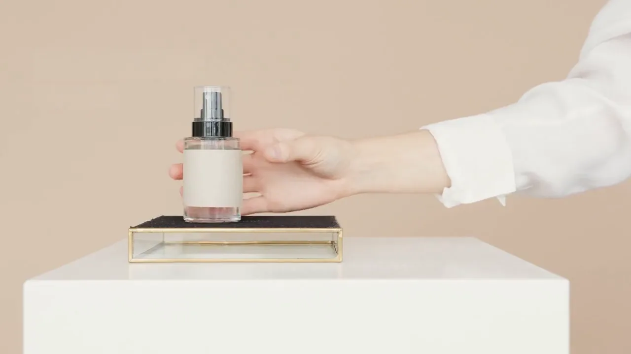 After: the same licensed product-video frame after text cleanup with the bottle still in frame